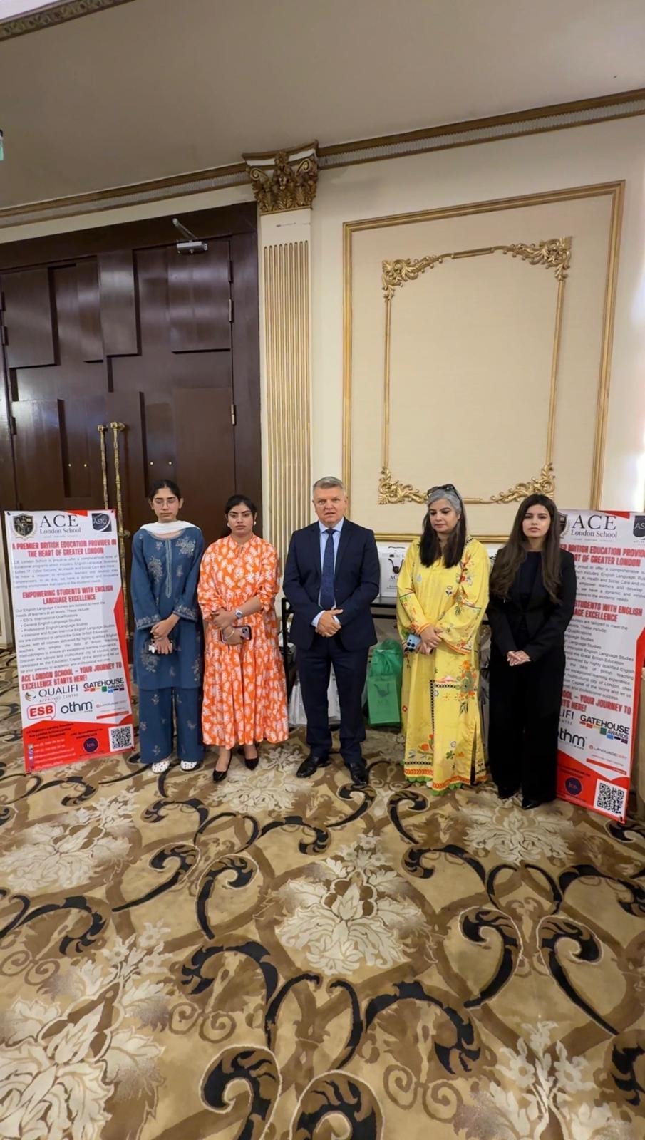 ACE London School Principal with students and partners at formal event