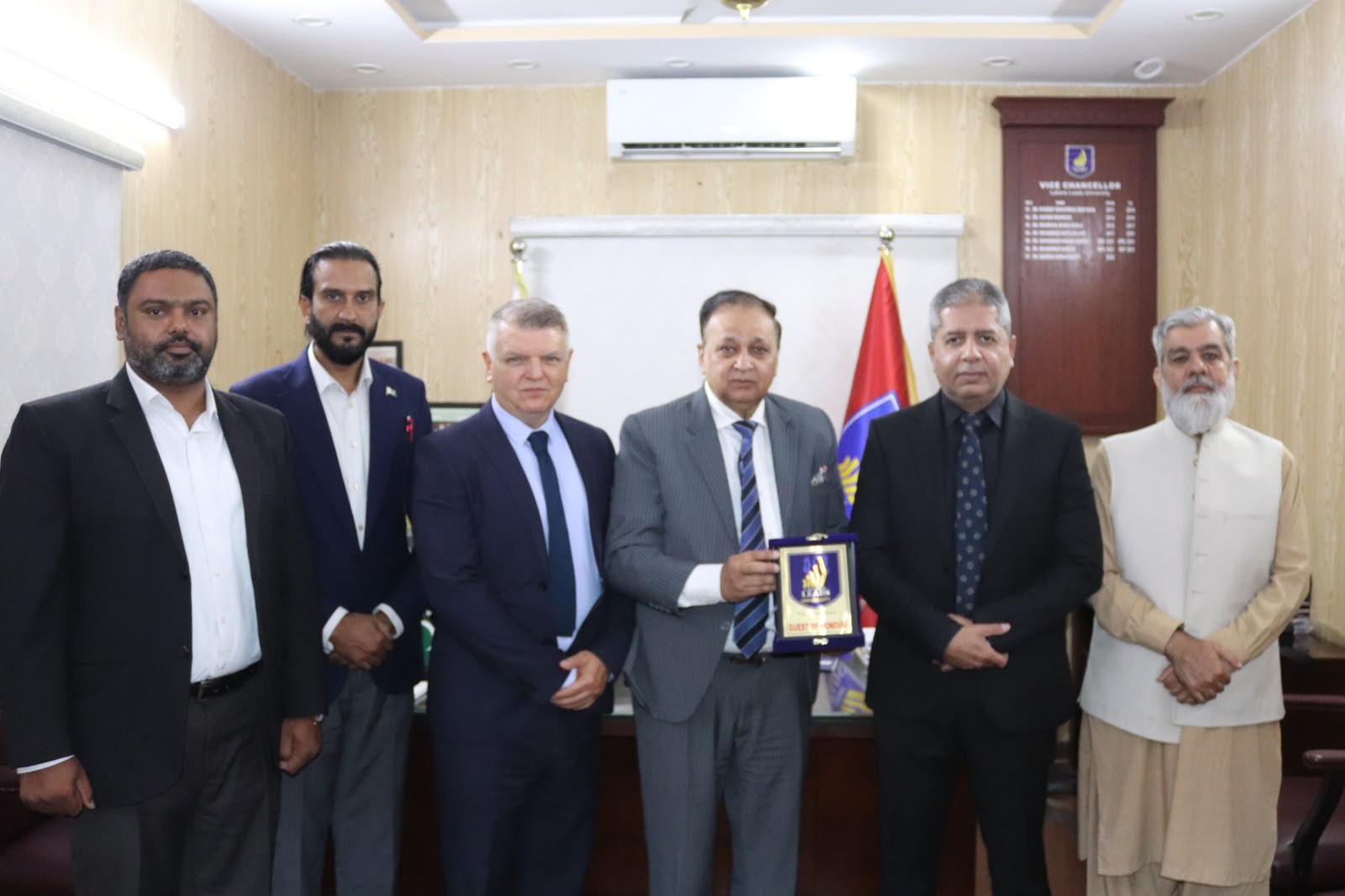 ACE London School Principal receiving Guest of Honour shield from Vice Chancellor at Lahore Leads University — official MOU visit