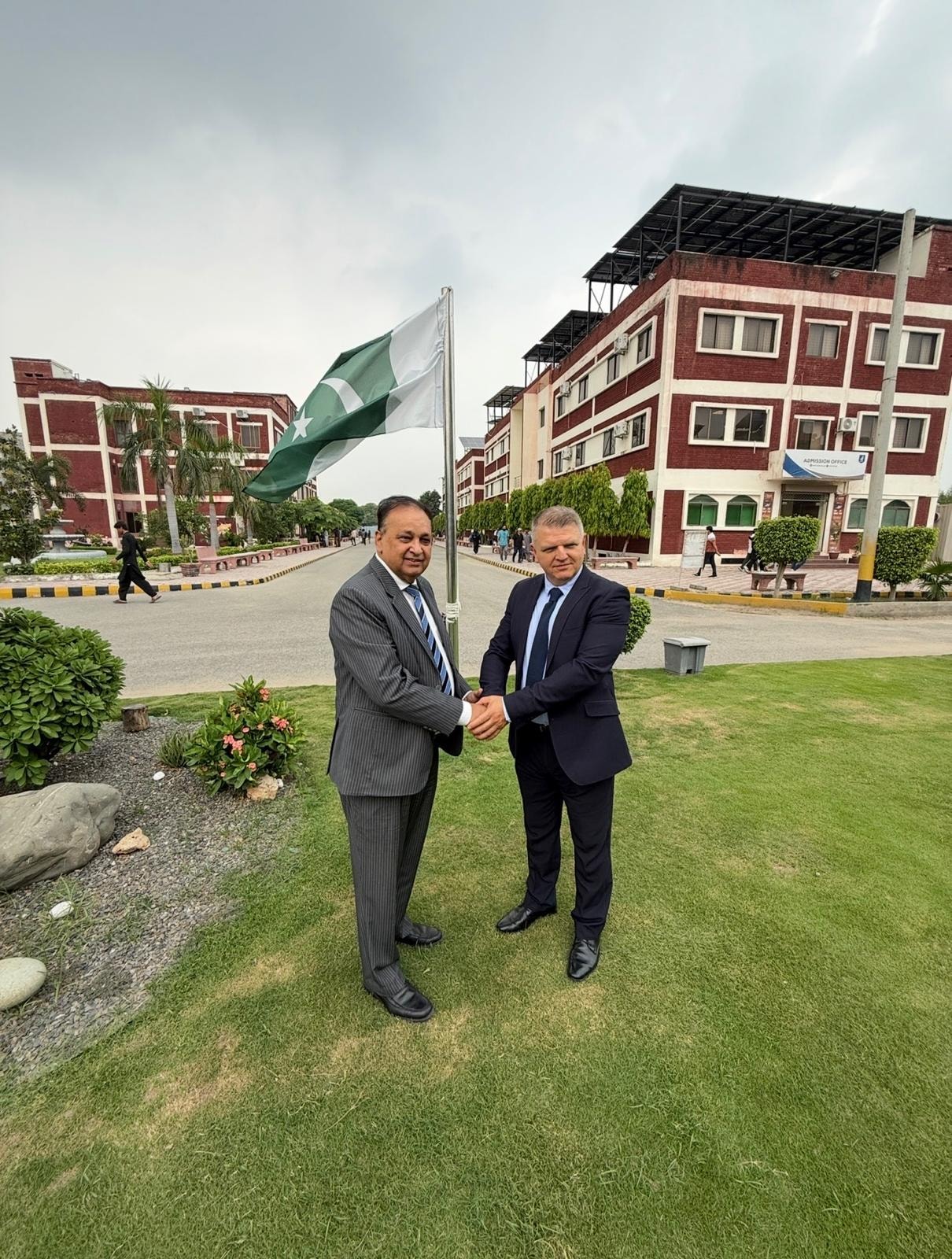 ACE London School partnership handshake at Pakistani university campus
